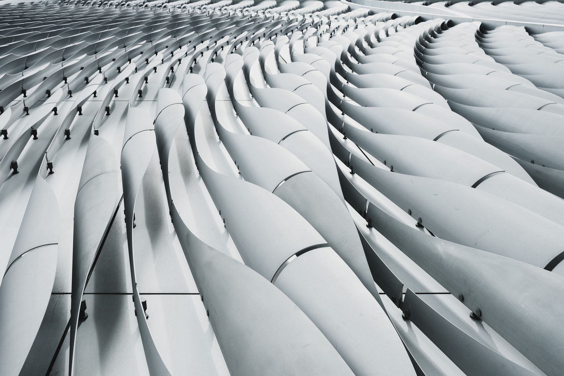 Close-up of the Xiqu Centre's modern architectural design in Kowloon, Hong Kong.