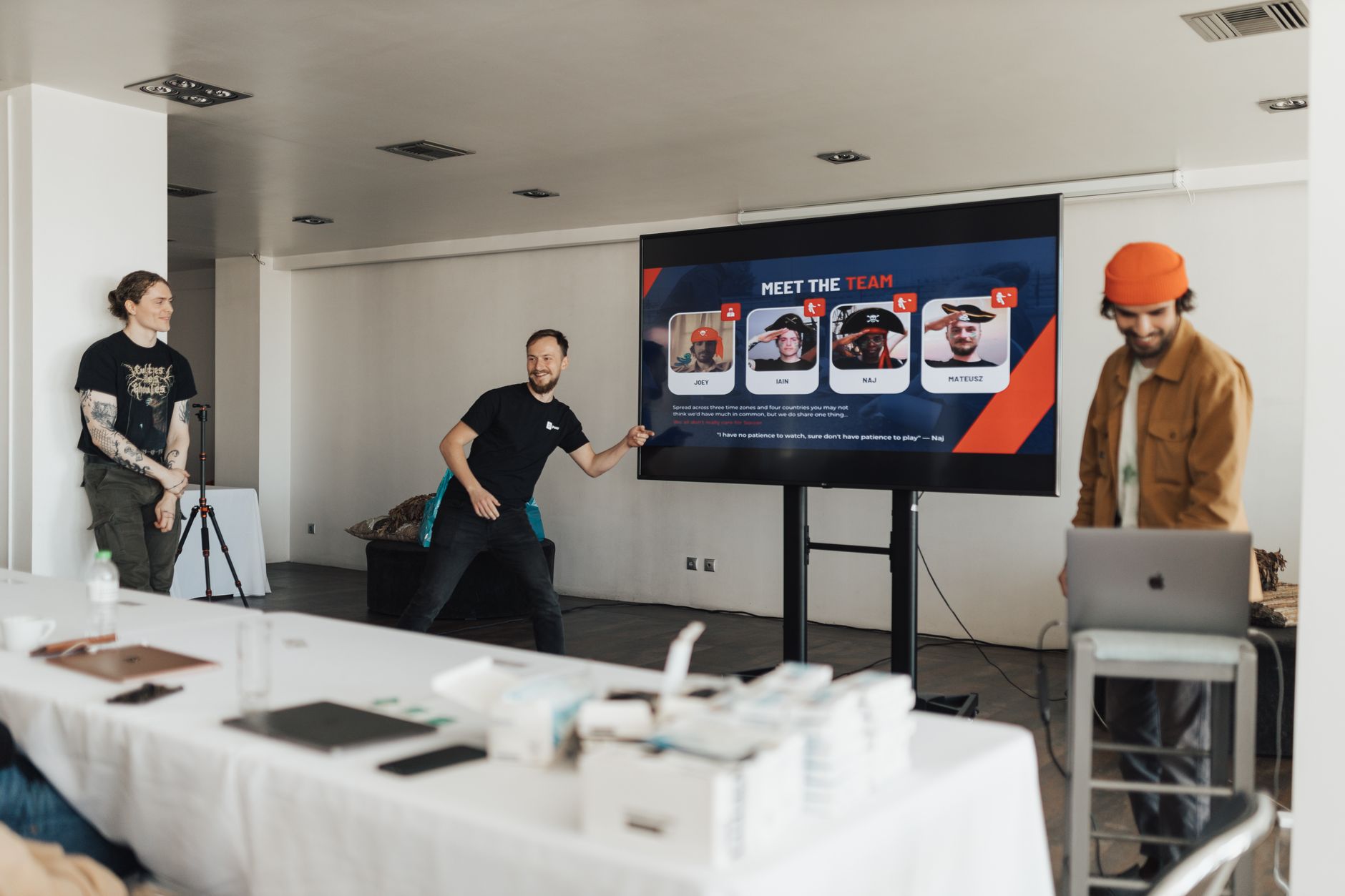 Team members presenting a project in a modern office setting with a focus on collaboration.