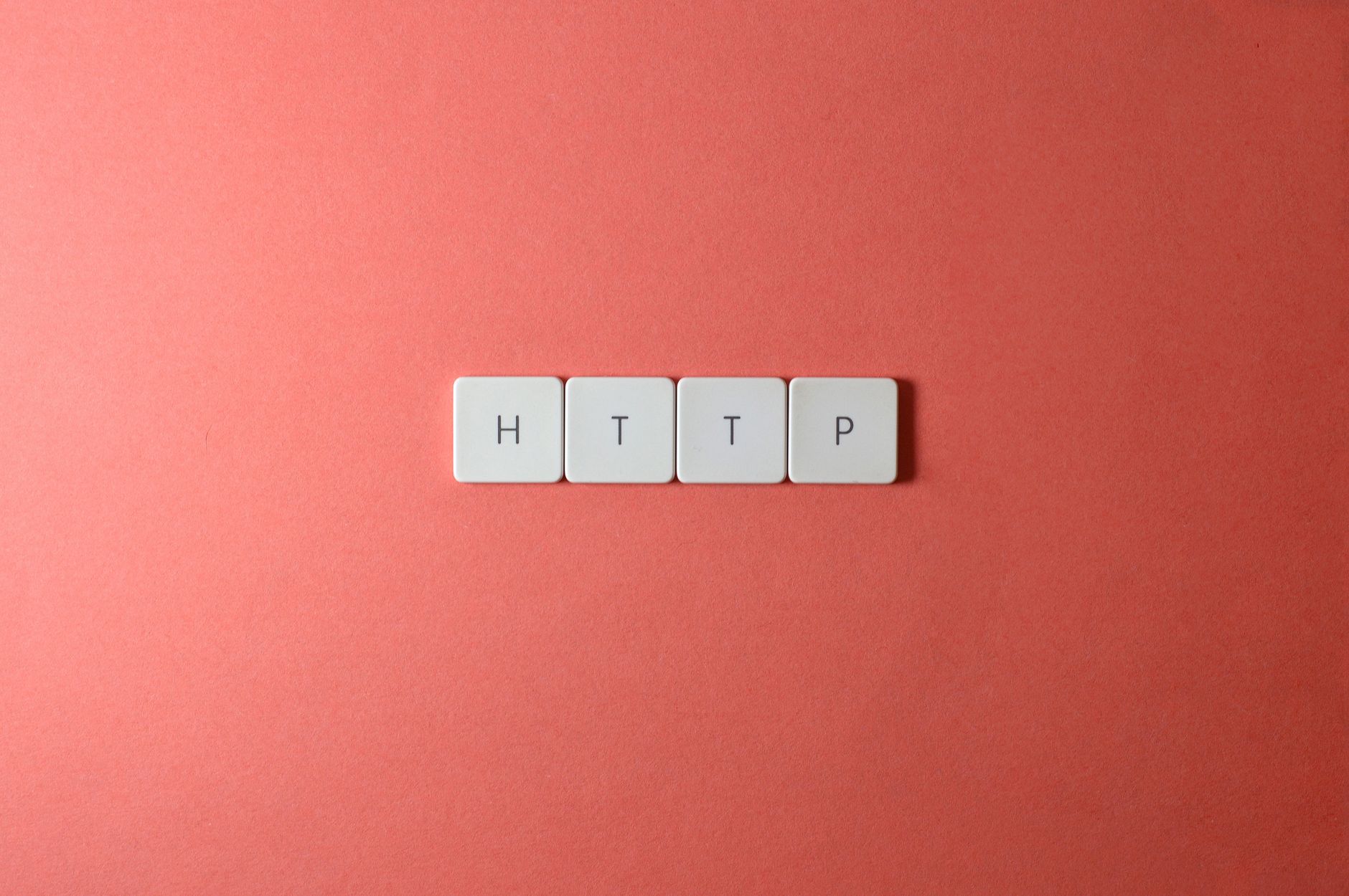 HTTP spelled with keyboard keys on a pink background, minimalist style.