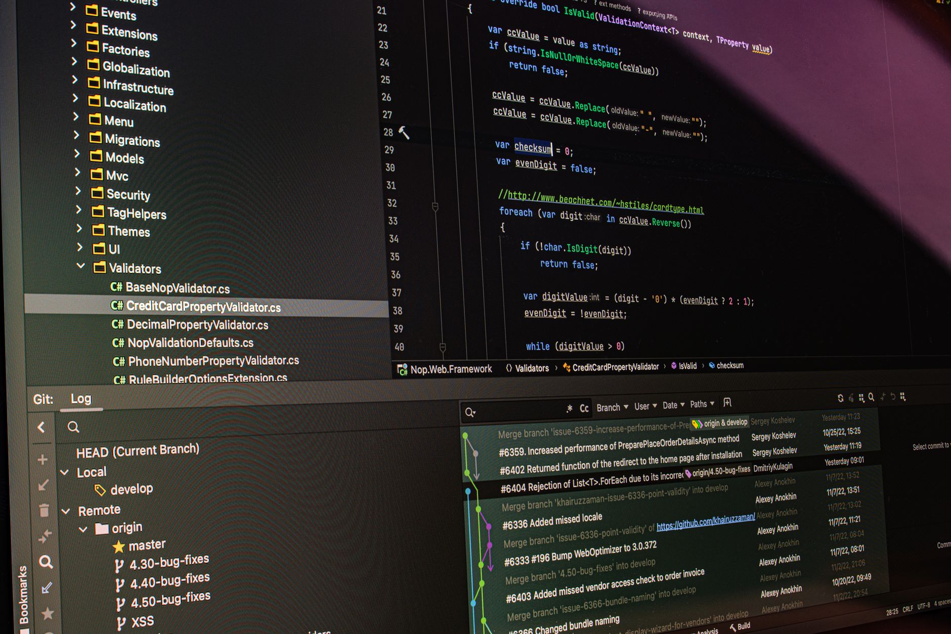 Close-up of software development tools displaying code and version control systems on a computer monitor.