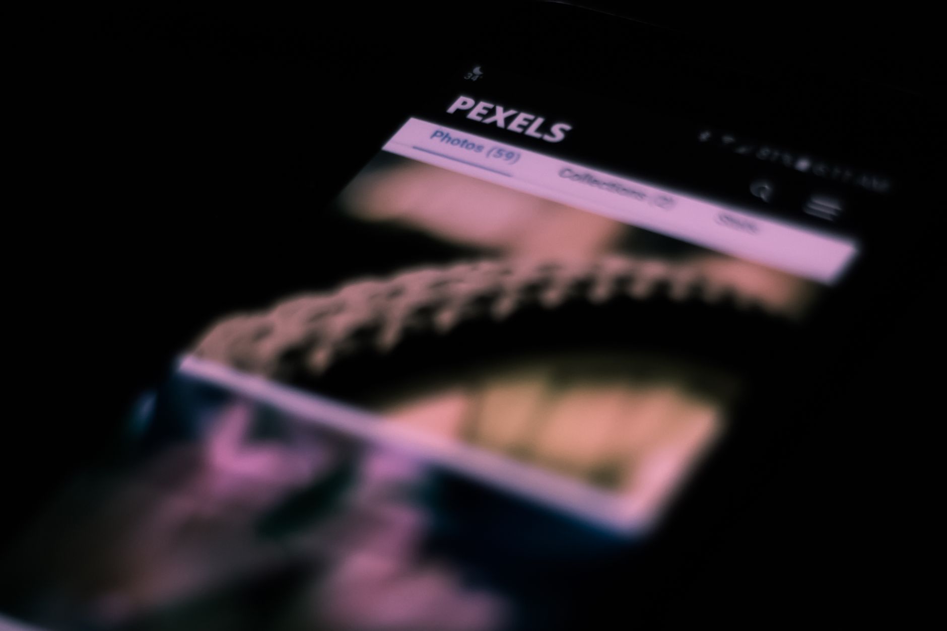 Abstract shot of a smartphone screen with blurred images and text, creating an artistic effect.