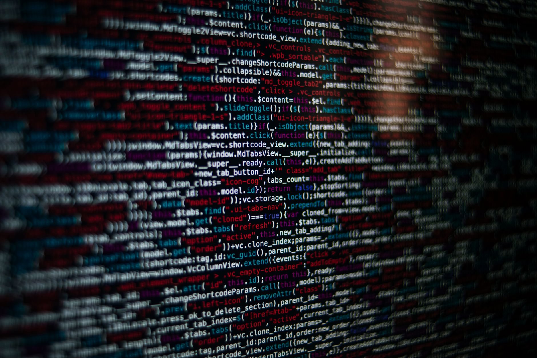 Detailed image of computer source code displayed on a screen, showcasing web development elements.