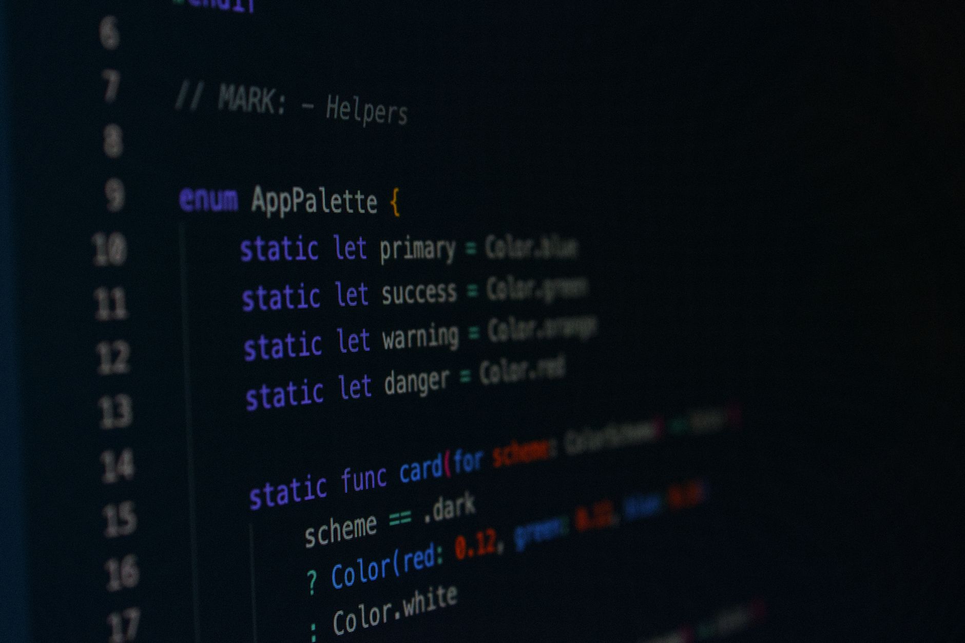 Macro photography of color palette code in a programming environment.
