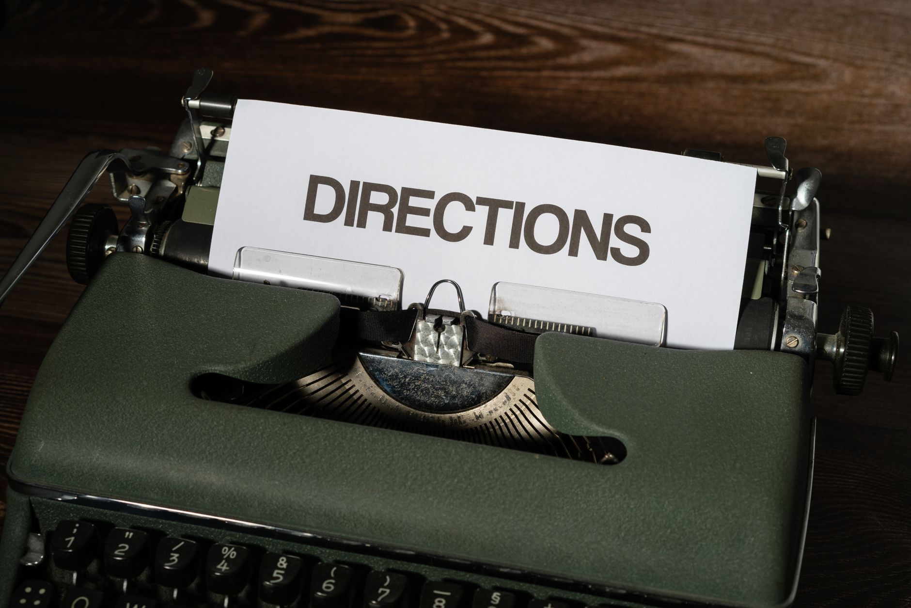 A vintage typewriter displaying the word 'DIRECTIONS' on paper, evoking nostalgia.