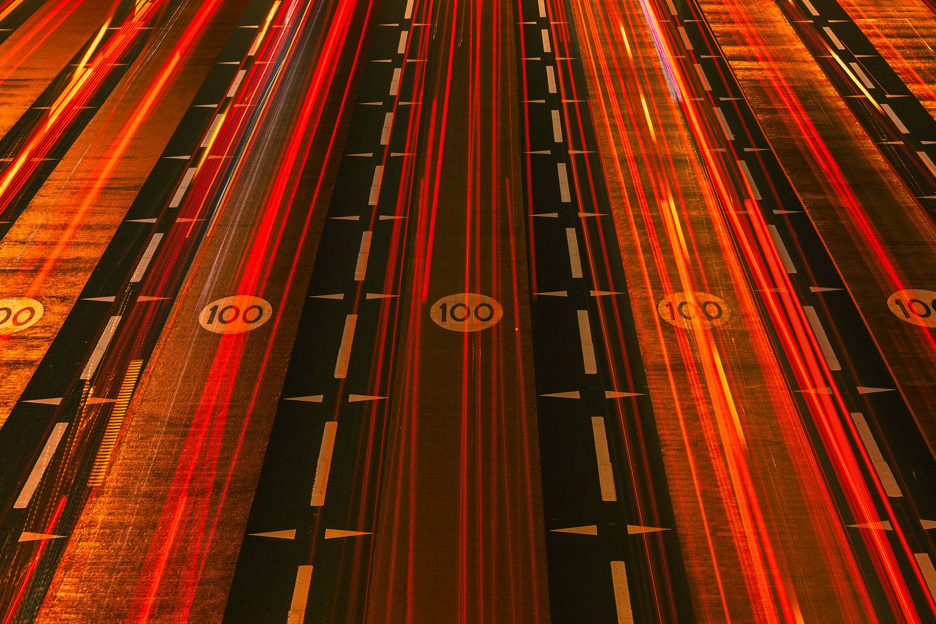 Long exposure night shot of busy expressway in Dubai illustrating urban speed and motion.